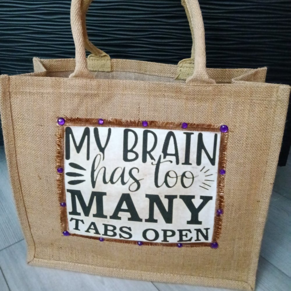 New jute tote embellished with a jewel trimmed saying "My Brain Has Too Many "